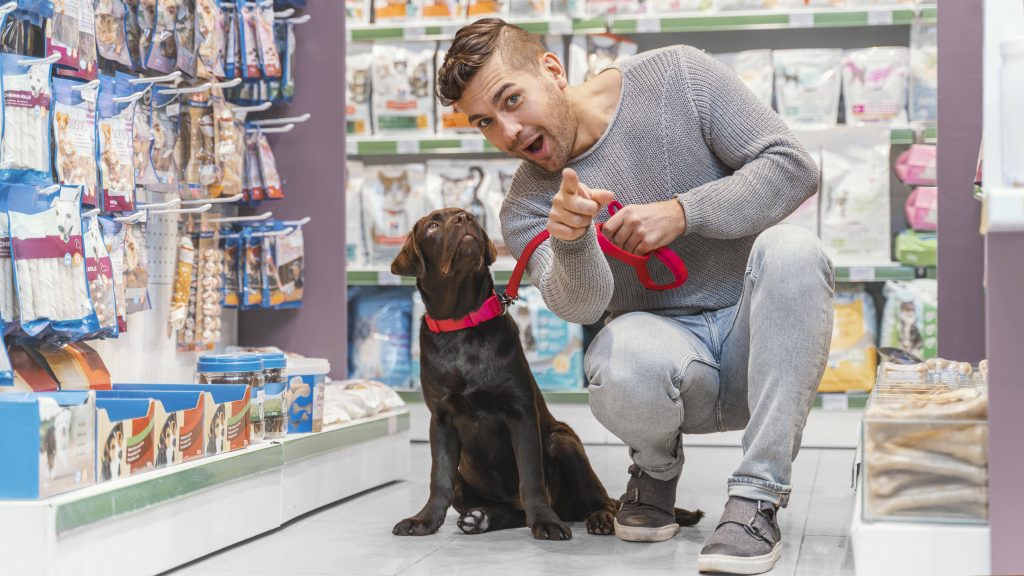 adorable-dog-with-owner-pet-shop